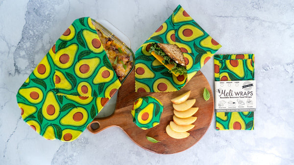 Avocado print beeswax wrap roll from Meli Wraps used to cover a dish of food