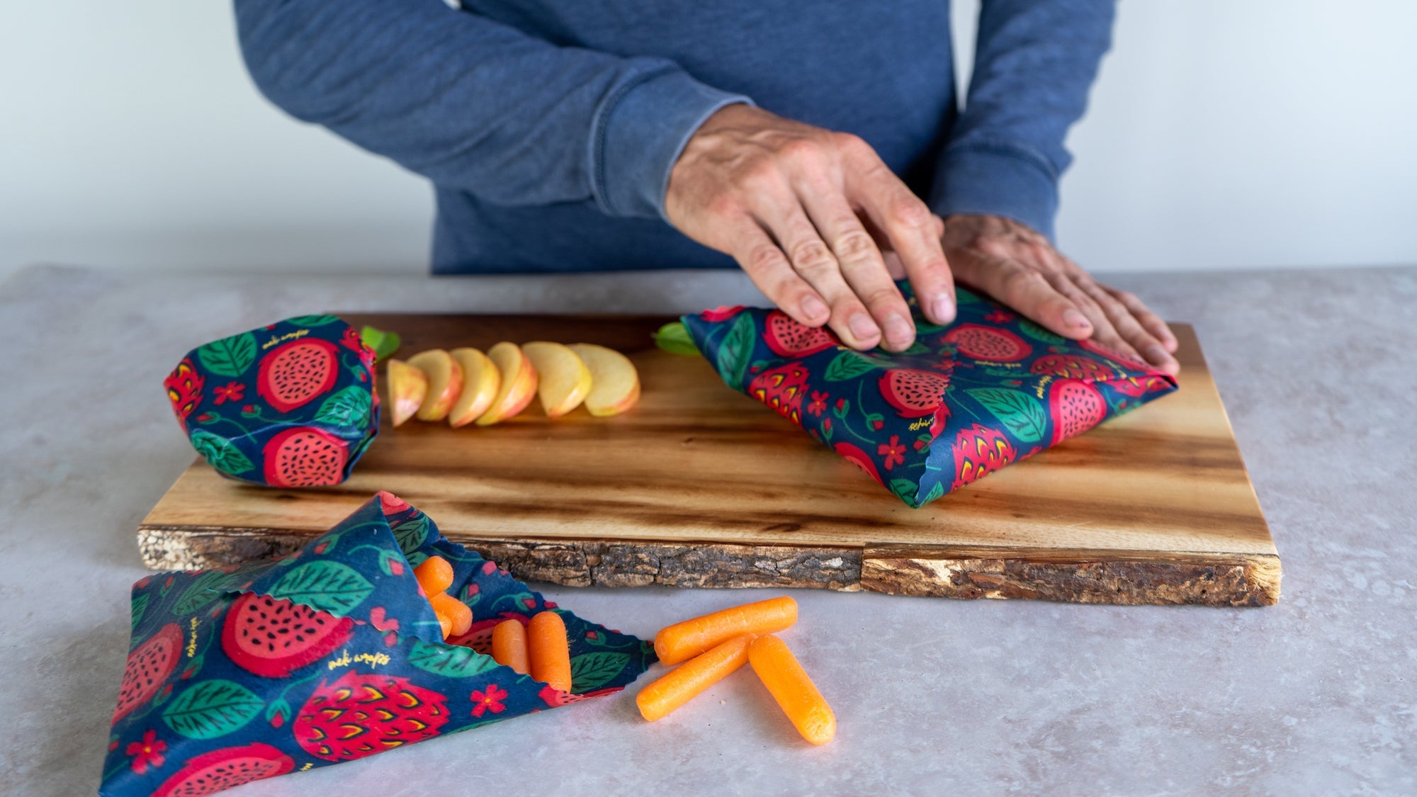 Large beeswax wrap from the Fruit Print variety pack covering a bowl