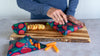 Large beeswax wrap from the Fruit Print variety pack covering a bowl
