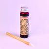 Mini and original size glass vials of Hibiscus Lip Stain by Plant Makeup