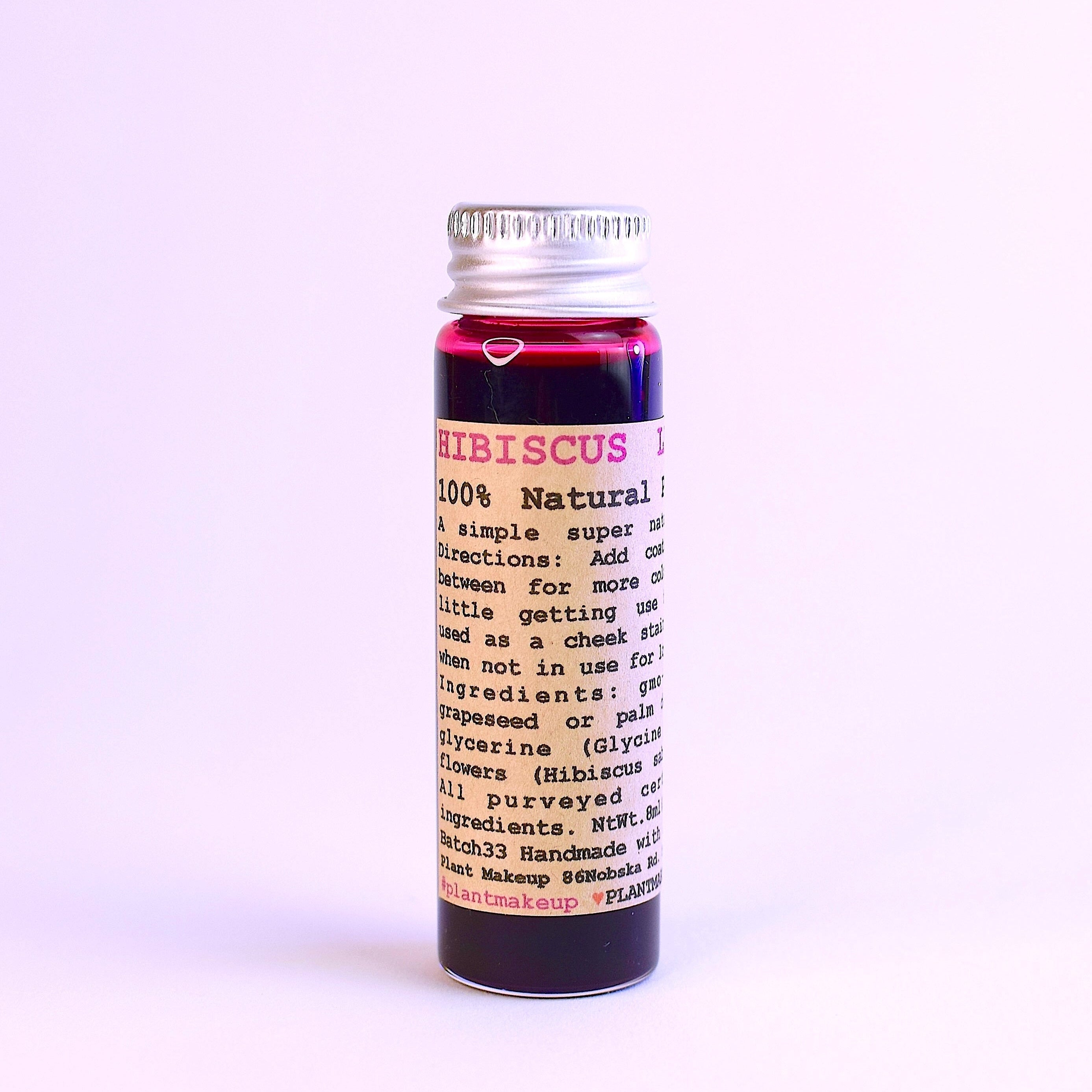Bottle of HIBISCUS powder with a white background