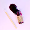 Hibiscus Lip Stain liquid lip gloss applied showing glossy purple-tinted finish