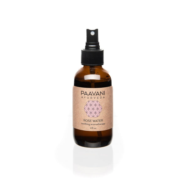 Rose water spray bottle with 'Paavani Ayurveda' label on a white background