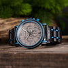 Close-up of personalised wooden watch back engraving detail with natural wood band