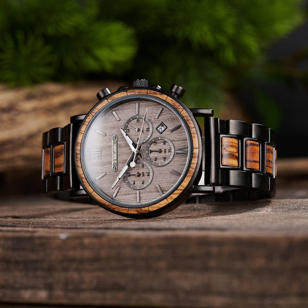 Close-up of personalised wooden wristwatch showing chronograph dial and wood grain detail