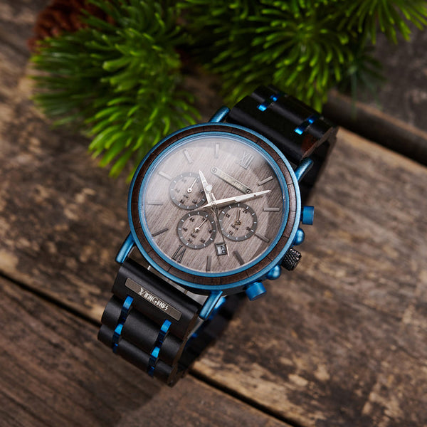 Black and blue wooden chronograph watch displayed in engraved wooden gift box