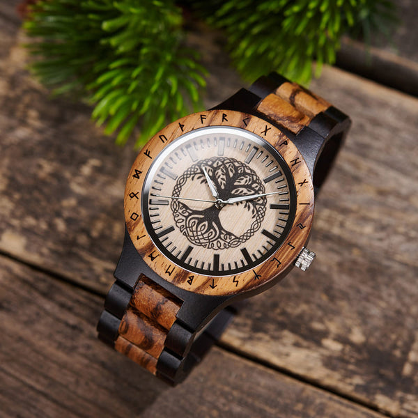 Custom engraved Yggdrasil wooden watch with zebra wood and ebony band, shown on wrist
