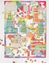 Cat Town Whimsy 1000-piece puzzle pieces spread out, showing random-cut snug-fit pieces and low-dust chipboard quality