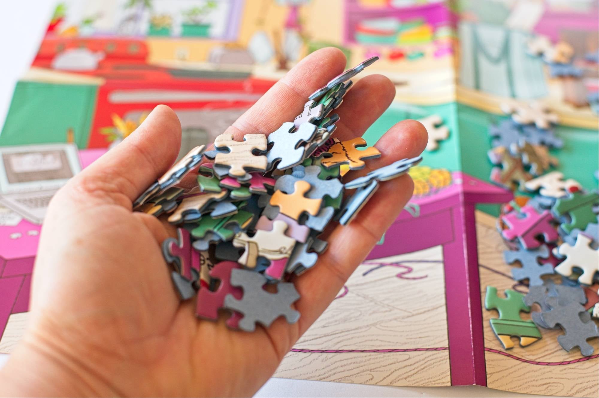 Your Mom Is So Berkeley puzzle pieces spread out during assembly, showing detailed Berkeley-themed illustration