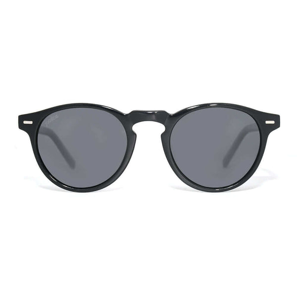 Black sunglasses with dark lenses on a white background