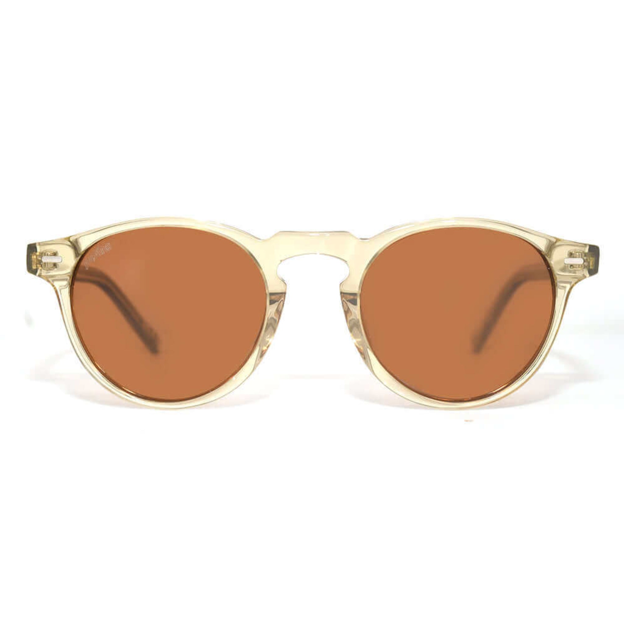 Sunglasses with gold frame and brown lenses on a white background