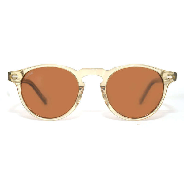 Sunglasses with gold frame and brown lenses on a white background