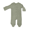 Green baby onesie with buttons on a white background