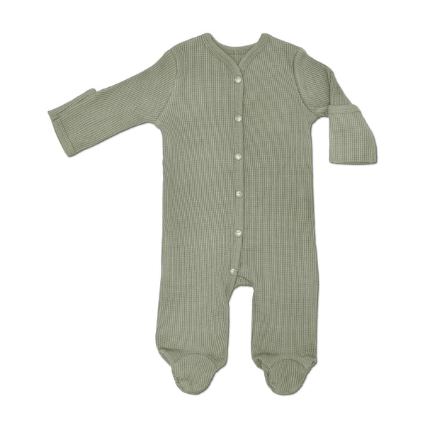 Green baby onesie with buttons on a white background