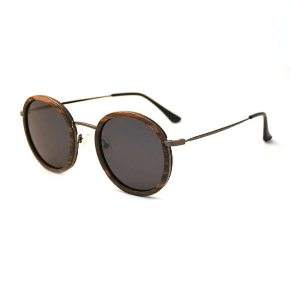 Round sunglasses with wooden frame and dark lenses on a white background