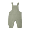 Green ribbed overalls on a white background