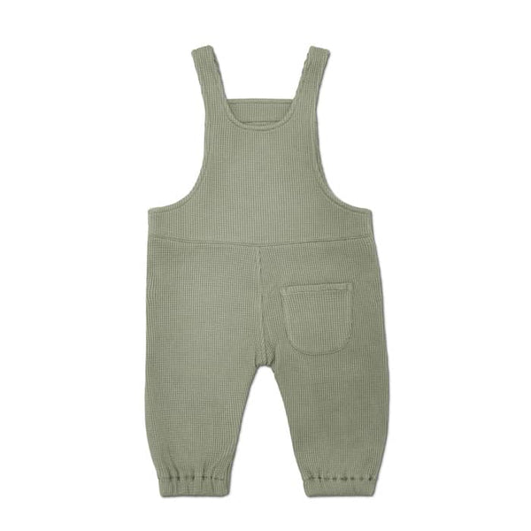 Green ribbed knit overalls on a white background