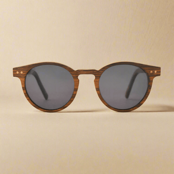 Wooden-framed sunglasses with dark lenses on a beige background