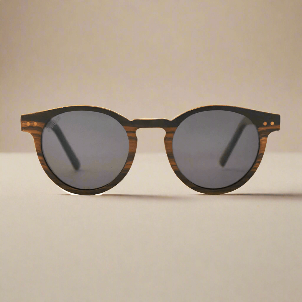 Sunglasses with wooden frame and dark lenses on a light background