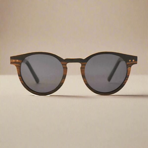 Sunglasses with wooden frame and dark lenses on a light background