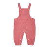 Pink checkered baby overalls on a white background