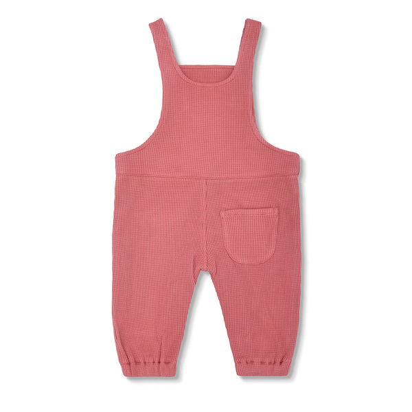 Pink ribbed overalls on a white background