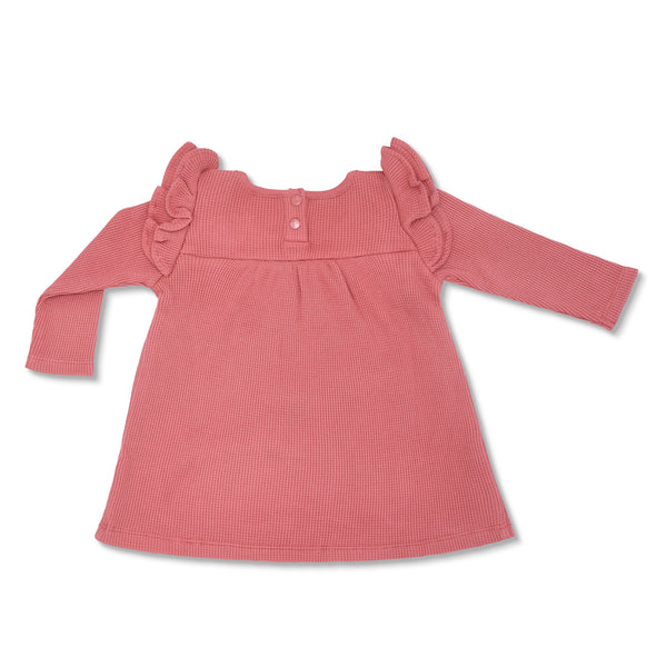 Pink dress with ruffled shoulders on a white background