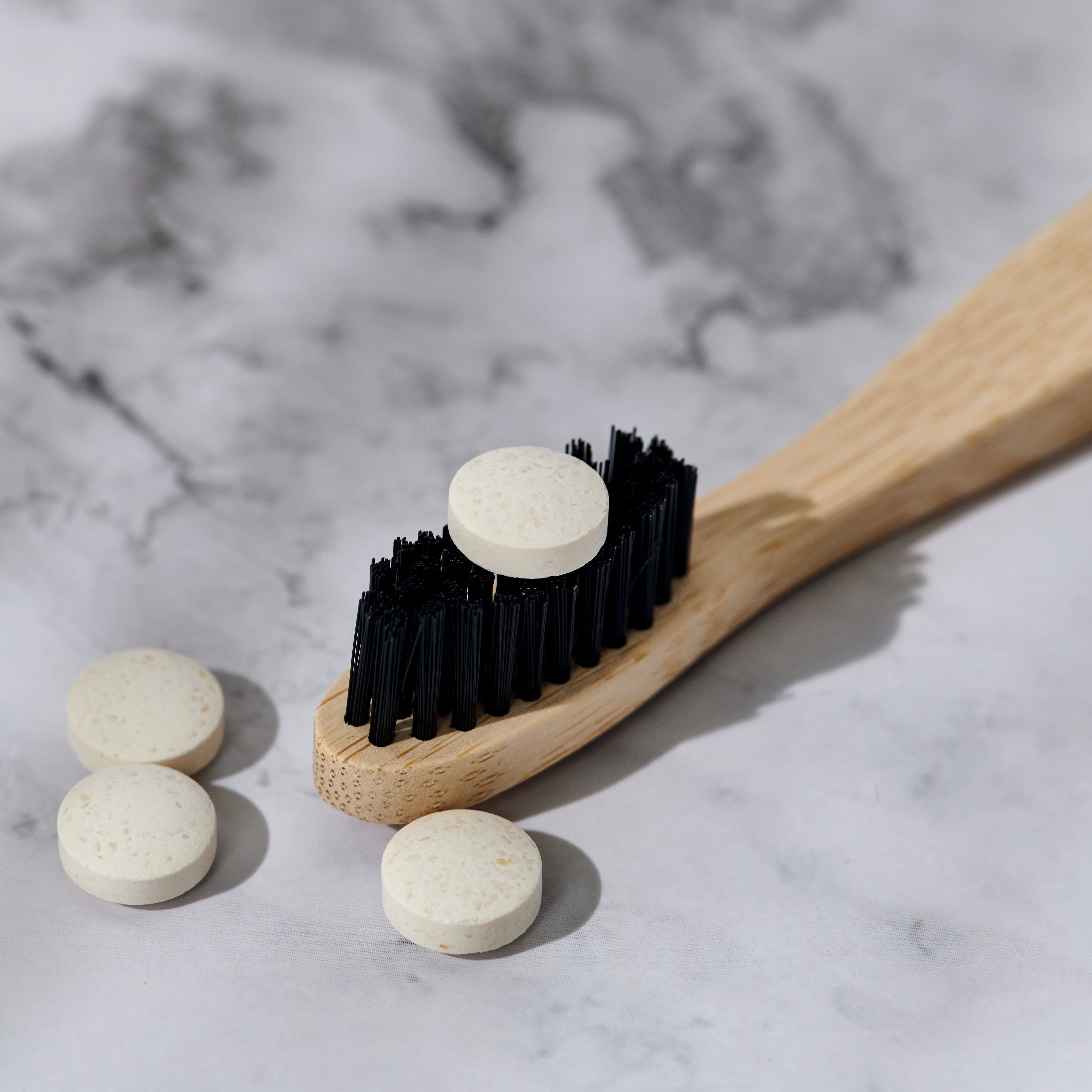 Close-up of Desesh zero waste toothpaste tablets for a sustainable plastic-free dental routine