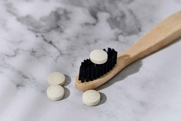 Close-up of Desesh zero waste toothpaste tablets — natural mint flavour, SLS-free formula