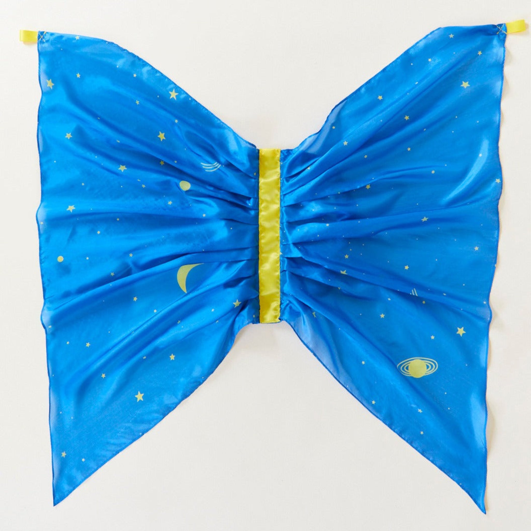 Blue butterfly costume wings with space-themed design on a white background. Spark your child's imagination with our Star Fairy Wings. Made from 100% pure silk, these eco-friendly dress-up wings are perfect for open-ended play, supporting creativity and fun.