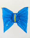 Blue butterfly costume wings with yellow accents on a light gray background. Spark your child's imagination with our Star Fairy Wings. Made from 100% pure silk, these eco-friendly dress-up wings are perfect for open-ended play, supporting creativity and fun.