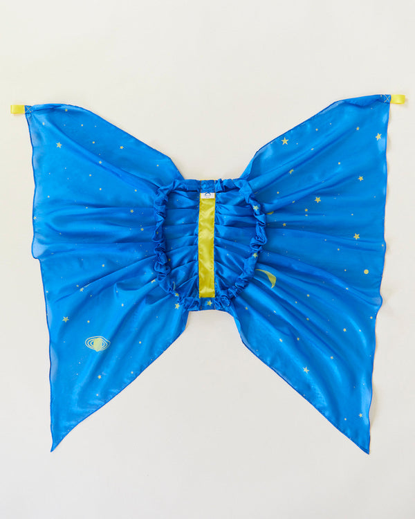 Blue butterfly costume wings with yellow accents on a light gray background. Spark your child's imagination with our Star Fairy Wings. Made from 100% pure silk, these eco-friendly dress-up wings are perfect for open-ended play, supporting creativity and fun.