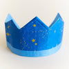 Blue paper crown with gold stars on a white background
