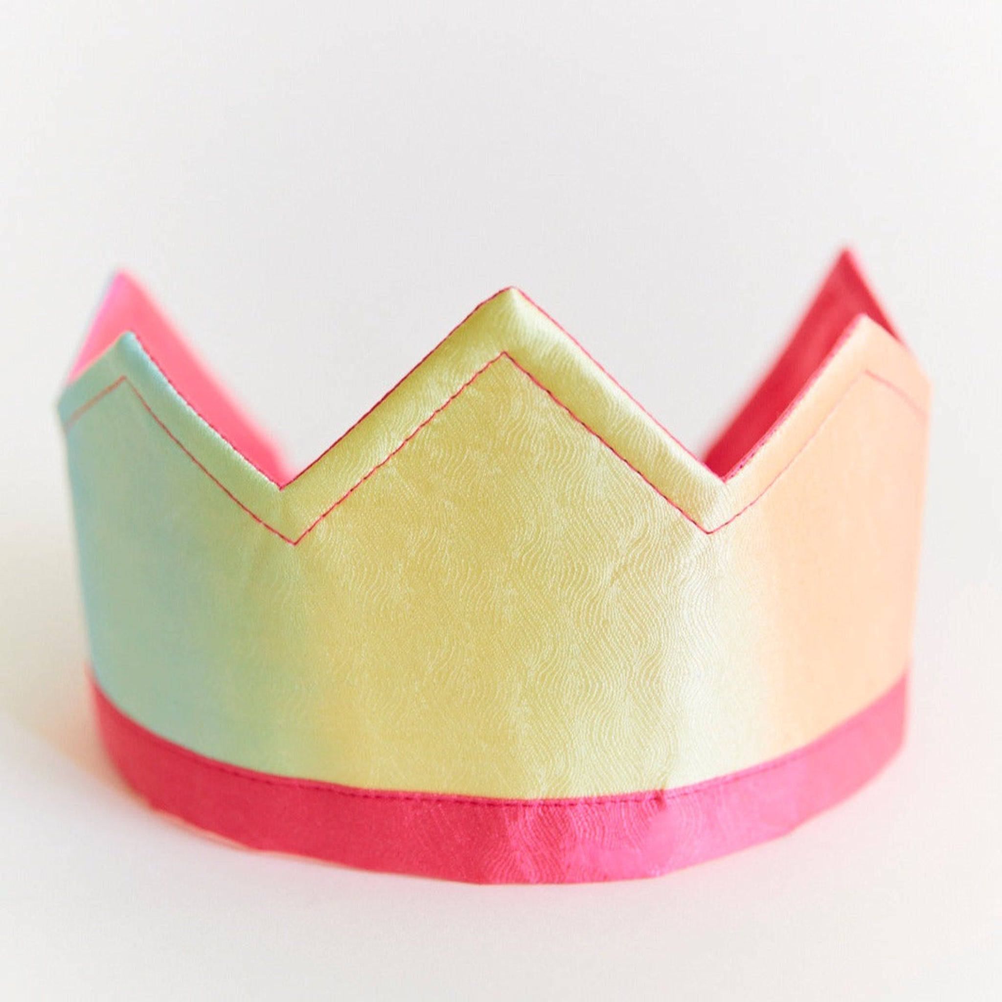 Colorful paper crown on a white background