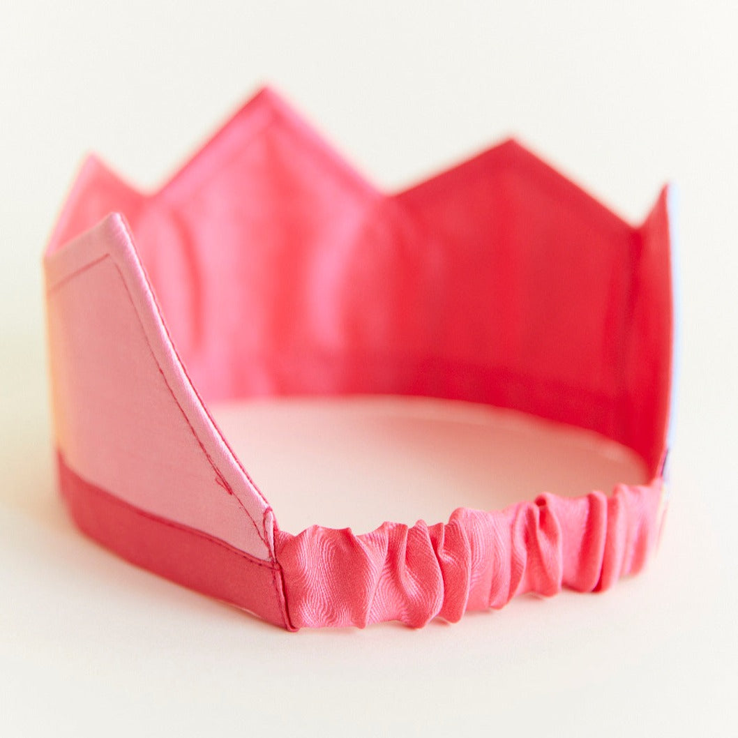 Pink tiara on a white background