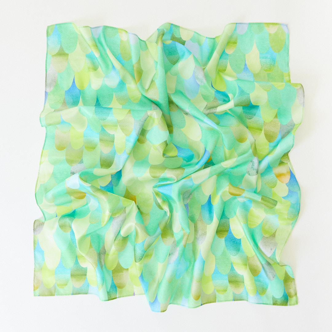 Colorful scarf with a watercolor pattern on a white background