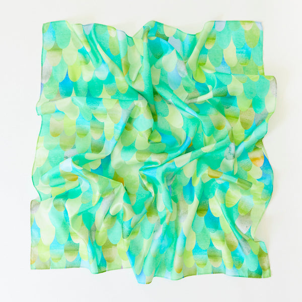 Colorful scarf with a watercolor pattern on a white background