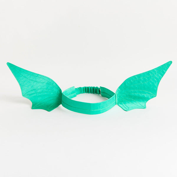 Turquoise fairy wings on a white background