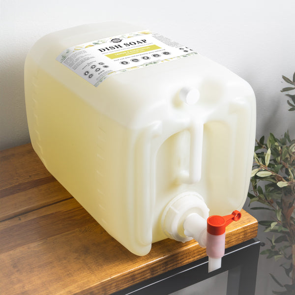 Large plastic container with a pump on a wooden surface