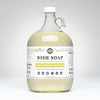 Large glass bottle of dish soap with a label on a white background