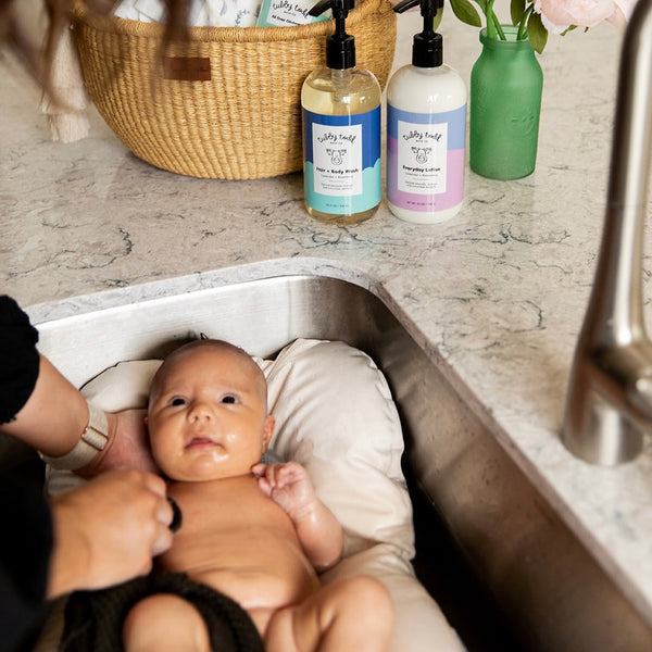 Little Dove baby sink bather laid flat showing full size and lightweight polyester fabric construction