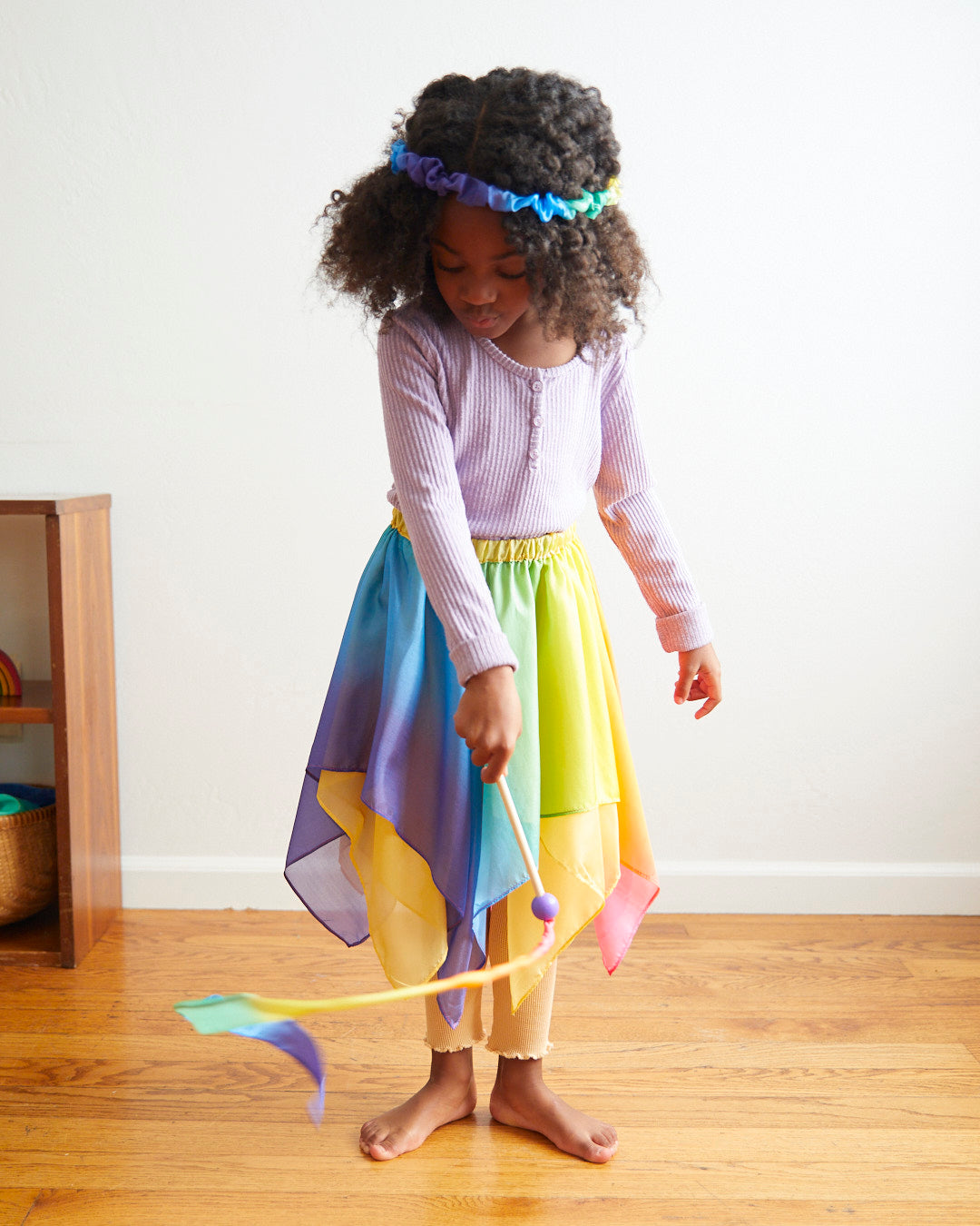 Transform your child into a magical fairy with our Rainbow Silk Fairy Skirt. This versatile and comfortable skirt is perfect for dress-up, Halloween, and endless imaginative adventures.