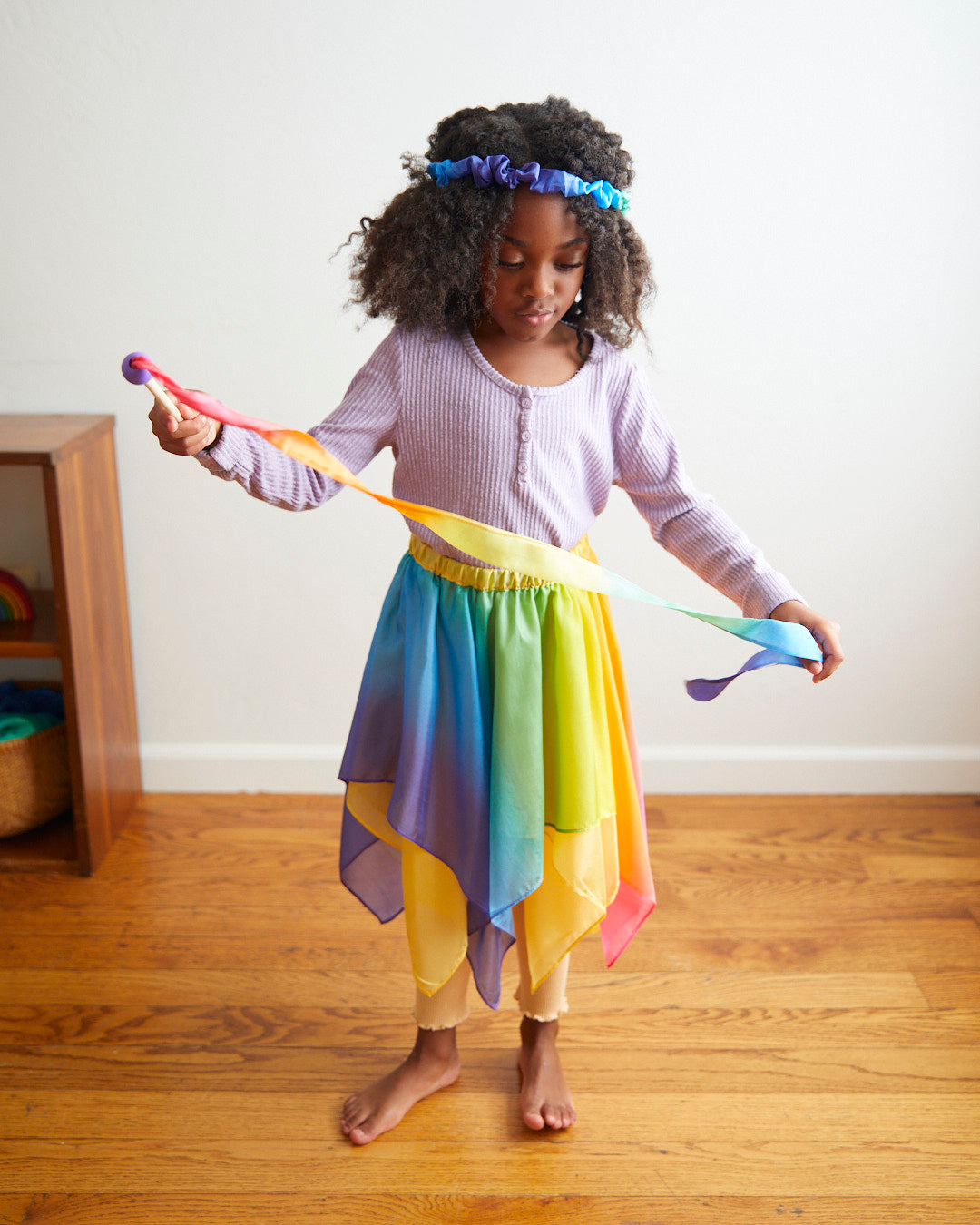 Transform your child into a magical fairy with our Rainbow Silk Fairy Skirt. This versatile and comfortable skirt is perfect for dress-up, Halloween, and endless imaginative adventures.