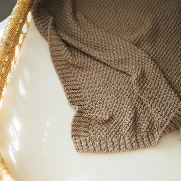 Close-up of pewter knitted baby blanket texture, highlighting 100% cotton rib and garter stitch pattern