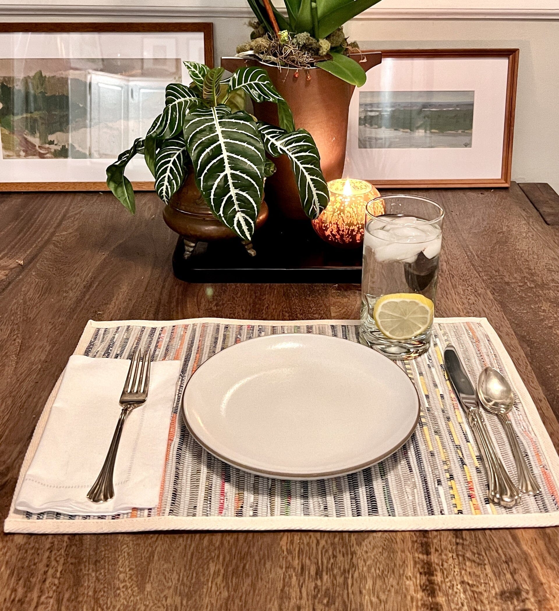Lifestyle shot of eco-friendly woven placemats styled on a dining table