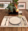 Lifestyle shot of eco-friendly woven placemats styled on a dining table