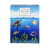 Children's art pad with ocean design featuring a turtle, fish, and coral.