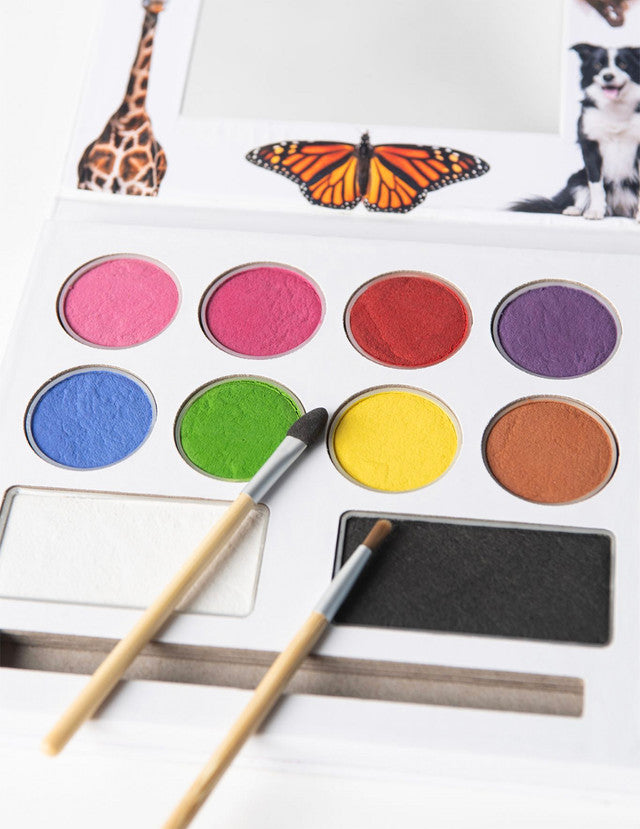 Child with colourful non-toxic face paint applied using Eco-Kids palette
