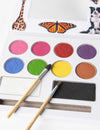 Child with colourful non-toxic face paint applied using Eco-Kids palette