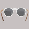 Sunglasses with round lenses and wooden frames on a white background